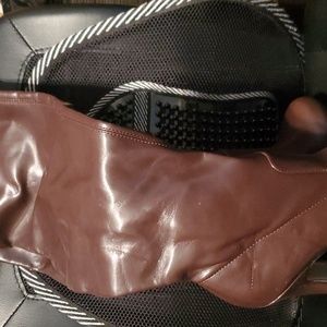 Thigh high, brown, laced stilletto Getty WC platform boots.